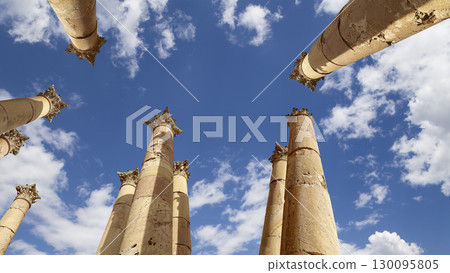 Roman Columns in the Jordanian city of Jerash (Gerasa of Antiquity), capital and largest city of Jerash Governorate, Jordan. Against the background of a beautiful sky with clouds Roman Columns in the Jordanian city of Jerash (Gerasa of Antiquity), capital and largest city of Jerash Governorate, Jordan. Against the background of a beautiful sky with clouds 130095805
