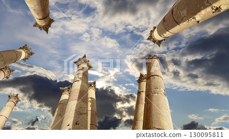 Roman Columns in the Jordanian city of Jerash (Gerasa of Antiquity), capital and largest city of Jerash Governorate, Jordan. Against the background of a beautiful sky with clouds Roman Columns in the Jordanian city of Jerash (Gerasa of Antiquity), capital and largest city of Jerash Governorate, Jordan. Against the background of a beautiful sky with clouds 130095811