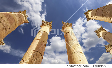 Roman Columns in the Jordanian city of Jerash (Gerasa of Antiquity), capital and largest city of Jerash Governorate, Jordan. Against the background of a beautiful sky with clouds Roman Columns in the Jordanian city of Jerash (Gerasa of Antiquity), capital and largest city of Jerash Governorate, Jordan. Against the background of a beautiful sky with clouds 130095853
