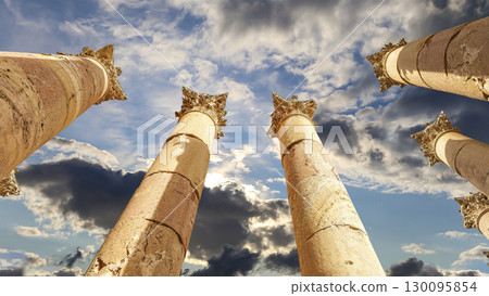 Roman Columns in the Jordanian city of Jerash (Gerasa of Antiquity), capital and largest city of Jerash Governorate, Jordan. Against the background of a beautiful sky with clouds Roman Columns in the Jordanian city of Jerash (Gerasa of Antiquity), capital and largest city of Jerash Governorate, Jordan. Against the background of a beautiful sky with clouds 130095854