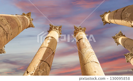 Roman Columns in the Jordanian city of Jerash (Gerasa of Antiquity), capital and largest city of Jerash Governorate, Jordan. Against the background of a beautiful sky with clouds 130095858