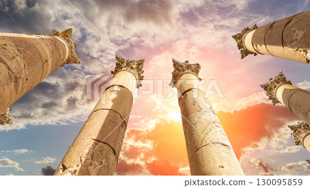 Roman Columns in the Jordanian city of Jerash (Gerasa of Antiquity), capital and largest city of Jerash Governorate, Jordan. Against the background of a beautiful sky with clouds 130095859