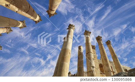 Roman Columns in the Jordanian city of Jerash (Gerasa of Antiquity), capital and largest city of Jerash Governorate, Jordan. Against the background of a beautiful sky with clouds 130095866