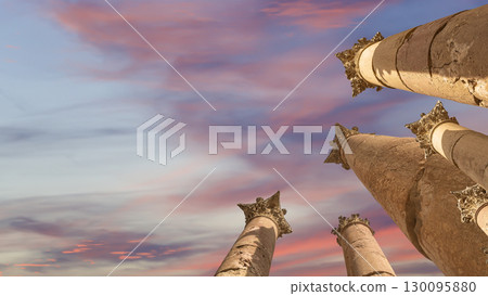 Roman Columns in the Jordanian city of Jerash (Gerasa of Antiquity), capital and largest city of Jerash Governorate, Jordan. Against the background of a beautiful sky with clouds Roman Columns in the Jordanian city of Jerash (Gerasa of Antiquity), capital and largest city of Jerash Governorate, Jordan. Against the background of a beautiful sky with clouds 130095880