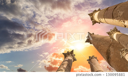 Roman Columns in the Jordanian city of Jerash (Gerasa of Antiquity), capital and largest city of Jerash Governorate, Jordan. Against the background of a beautiful sky with clouds 130095881