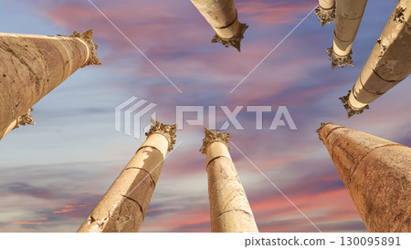 Roman Columns in the Jordanian city of Jerash (Gerasa of Antiquity), capital and largest city of Jerash Governorate, Jordan. Against the background of a beautiful sky with clouds Roman Columns in the Jordanian city of Jerash (Gerasa of Antiquity), capital and largest city of Jerash Governorate, Jordan. Against the background of a beautiful sky with clouds 130095891