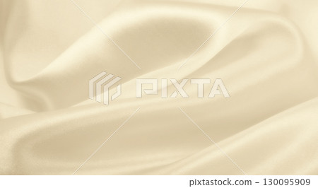 Smooth elegant golden silk or satin luxury cloth texture as wedding background. Luxurious background design. In Sepia toned. Retro style 130095909