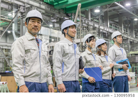 Group of workers working in a factory Group of workers working in a factory 130095958