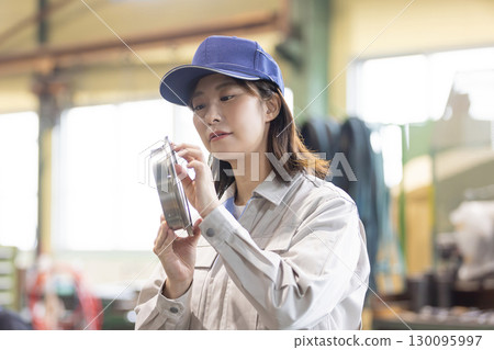 workers working in a factory workers working in a factory 130095997