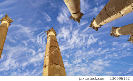 Roman Columns in the Jordanian city of Jerash (Gerasa of Antiquity), capital and largest city of Jerash Governorate, Jordan. Against the background of a beautiful sky with clouds 130096162