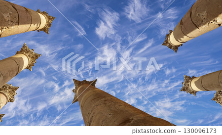 Roman Columns in the Jordanian city of Jerash (Gerasa of Antiquity), capital and largest city of Jerash Governorate, Jordan. Against the background of a beautiful sky with clouds 130096173