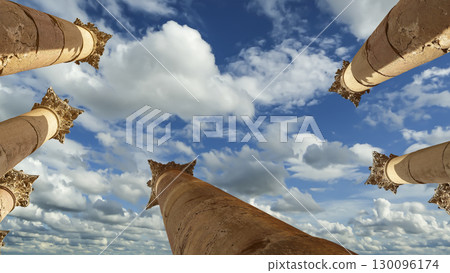 Roman Columns in the Jordanian city of Jerash (Gerasa of Antiquity), capital and largest city of Jerash Governorate, Jordan. Against the background of a beautiful sky with clouds 130096174
