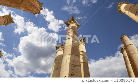 Roman Columns in the Jordanian city of Jerash (Gerasa of Antiquity), capital and largest city of Jerash Governorate, Jordan. Against the background of a beautiful sky with clouds Roman Columns in the Jordanian city of Jerash (Gerasa of Antiquity), capital and largest city of Jerash Governorate, Jordan. Against the background of a beautiful sky with clouds 130096178