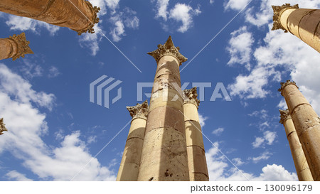Roman Columns in the Jordanian city of Jerash (Gerasa of Antiquity), capital and largest city of Jerash Governorate, Jordan. Against the background of a beautiful sky with clouds Roman Columns in the Jordanian city of Jerash (Gerasa of Antiquity), capital and largest city of Jerash Governorate, Jordan. Against the background of a beautiful sky with clouds 130096179