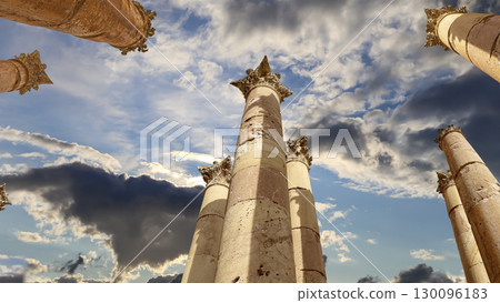 Roman Columns in the Jordanian city of Jerash (Gerasa of Antiquity), capital and largest city of Jerash Governorate, Jordan. Against the background of a beautiful sky with clouds 130096183
