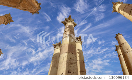 Roman Columns in the Jordanian city of Jerash (Gerasa of Antiquity), capital and largest city of Jerash Governorate, Jordan. Against the background of a beautiful sky with clouds 130096184