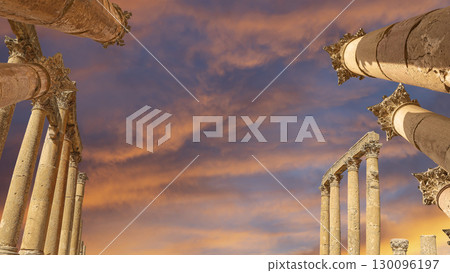 Roman Columns in the Jordanian city of Jerash (Gerasa of Antiquity), capital and largest city of Jerash Governorate, Jordan. Against the background of a beautiful sky with clouds 130096197