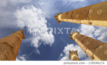 Roman Columns in the Jordanian city of Jerash (Gerasa of Antiquity), capital and largest city of Jerash Governorate, Jordan. Against the background of a beautiful sky with clouds 130096214