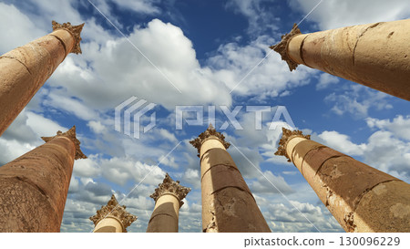 Roman Columns in the Jordanian city of Jerash (Gerasa of Antiquity), capital and largest city of Jerash Governorate, Jordan. Against the background of a beautiful sky with clouds 130096229