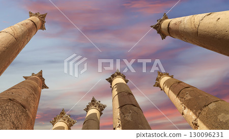 Roman Columns in the Jordanian city of Jerash (Gerasa of Antiquity), capital and largest city of Jerash Governorate, Jordan. Against the background of a beautiful sky with clouds 130096231