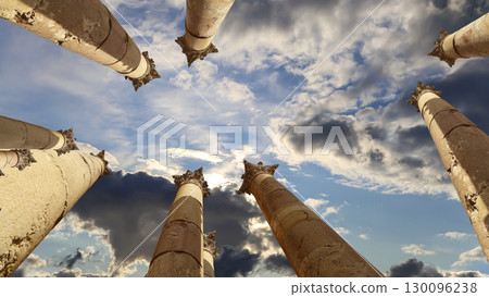 Roman Columns in the Jordanian city of Jerash (Gerasa of Antiquity), capital and largest city of Jerash Governorate, Jordan. Against the background of a beautiful sky with clouds Roman Columns in the Jordanian city of Jerash (Gerasa of Antiquity), capital and largest city of Jerash Governorate, Jordan. Against the background of a beautiful sky with clouds 130096238