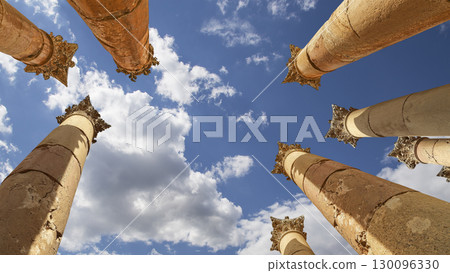 Roman Columns in the Jordanian city of Jerash (Gerasa of Antiquity), capital and largest city of Jerash Governorate, Jordan. Against the background of a beautiful sky with clouds 130096330