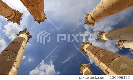 Roman Columns in the Jordanian city of Jerash (Gerasa of Antiquity), capital and largest city of Jerash Governorate, Jordan. Against the background of a beautiful sky with clouds 130096333