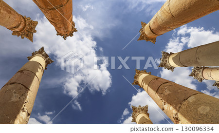 Roman Columns in the Jordanian city of Jerash (Gerasa of Antiquity), capital and largest city of Jerash Governorate, Jordan. Against the background of a beautiful sky with clouds Roman Columns in the Jordanian city of Jerash (Gerasa of Antiquity), capital and largest city of Jerash Governorate, Jordan. Against the background of a beautiful sky with clouds 130096334