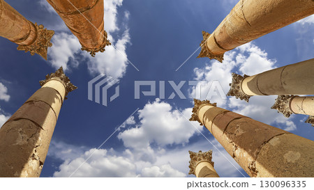 Roman Columns in the Jordanian city of Jerash (Gerasa of Antiquity), capital and largest city of Jerash Governorate, Jordan. Against the background of a beautiful sky with clouds Roman Columns in the Jordanian city of Jerash (Gerasa of Antiquity), capital and largest city of Jerash Governorate, Jordan. Against the background of a beautiful sky with clouds 130096335