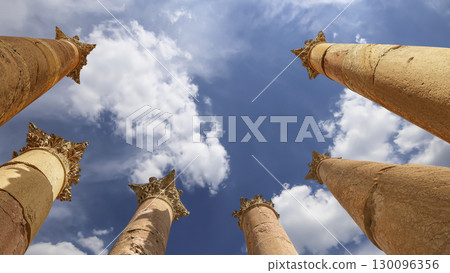 Roman Columns in the Jordanian city of Jerash (Gerasa of Antiquity), capital and largest city of Jerash Governorate, Jordan. Against the background of a beautiful sky with clouds 130096356