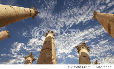 Roman Columns in the Jordanian city of Jerash (Gerasa of Antiquity), capital and largest city of Jerash Governorate, Jordan. Against the background of a beautiful sky with clouds 130096366