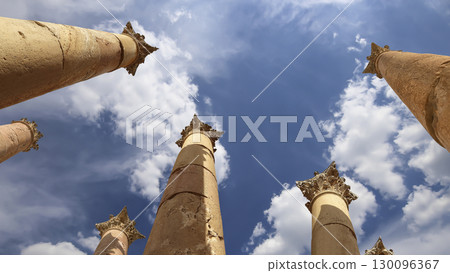 Roman Columns in the Jordanian city of Jerash (Gerasa of Antiquity), capital and largest city of Jerash Governorate, Jordan. Against the background of a beautiful sky with clouds 130096367