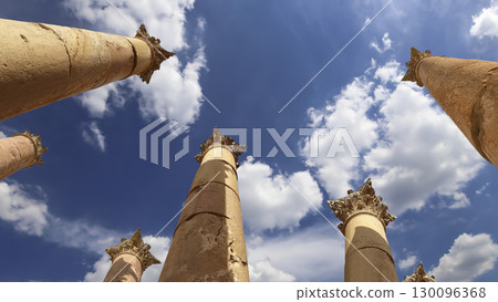 Roman Columns in the Jordanian city of Jerash (Gerasa of Antiquity), capital and largest city of Jerash Governorate, Jordan. Against the background of a beautiful sky with clouds 130096368
