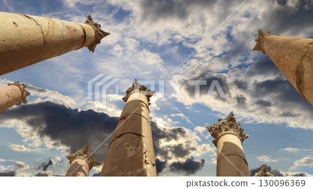 Roman Columns in the Jordanian city of Jerash (Gerasa of Antiquity), capital and largest city of Jerash Governorate, Jordan. Against the background of a beautiful sky with clouds Roman Columns in the Jordanian city of Jerash (Gerasa of Antiquity), capital and largest city of Jerash Governorate, Jordan. Against the background of a beautiful sky with clouds 130096369
