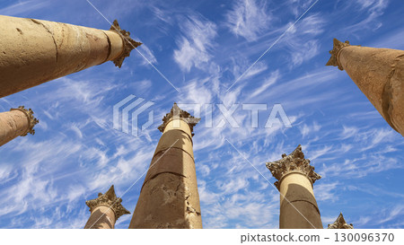 Roman Columns in the Jordanian city of Jerash (Gerasa of Antiquity), capital and largest city of Jerash Governorate, Jordan. Against the background of a beautiful sky with clouds Roman Columns in the Jordanian city of Jerash (Gerasa of Antiquity), capital and largest city of Jerash Governorate, Jordan. Against the background of a beautiful sky with clouds 130096370