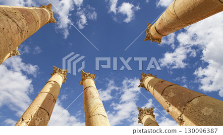Roman Columns in the Jordanian city of Jerash (Gerasa of Antiquity), capital and largest city of Jerash Governorate, Jordan. Against the background of a beautiful sky with clouds Roman Columns in the Jordanian city of Jerash (Gerasa of Antiquity), capital and largest city of Jerash Governorate, Jordan. Against the background of a beautiful sky with clouds 130096387