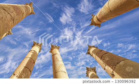 Roman Columns in the Jordanian city of Jerash (Gerasa of Antiquity), capital and largest city of Jerash Governorate, Jordan. Against the background of a beautiful sky with clouds Roman Columns in the Jordanian city of Jerash (Gerasa of Antiquity), capital and largest city of Jerash Governorate, Jordan. Against the background of a beautiful sky with clouds 130096392