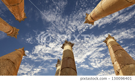 Roman Columns in the Jordanian city of Jerash (Gerasa of Antiquity), capital and largest city of Jerash Governorate, Jordan. Against the background of a beautiful sky with clouds Roman Columns in the Jordanian city of Jerash (Gerasa of Antiquity), capital and largest city of Jerash Governorate, Jordan. Against the background of a beautiful sky with clouds 130096401
