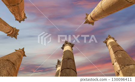 Roman Columns in the Jordanian city of Jerash (Gerasa of Antiquity), capital and largest city of Jerash Governorate, Jordan. Against the background of a beautiful sky with clouds Roman Columns in the Jordanian city of Jerash (Gerasa of Antiquity), capital and largest city of Jerash Governorate, Jordan. Against the background of a beautiful sky with clouds 130096411