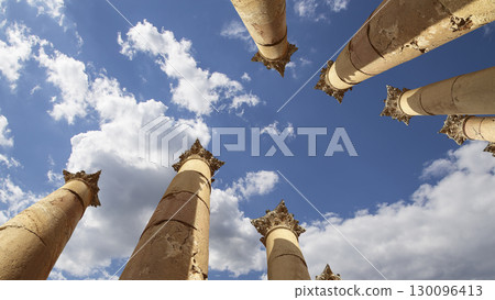 Roman Columns in the Jordanian city of Jerash (Gerasa of Antiquity), capital and largest city of Jerash Governorate, Jordan. Against the background of a beautiful sky with clouds Roman Columns in the Jordanian city of Jerash (Gerasa of Antiquity), capital and largest city of Jerash Governorate, Jordan. Against the background of a beautiful sky with clouds 130096413