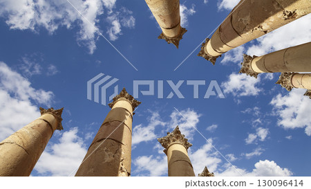 Roman Columns in the Jordanian city of Jerash (Gerasa of Antiquity), capital and largest city of Jerash Governorate, Jordan. Against the background of a beautiful sky with clouds Roman Columns in the Jordanian city of Jerash (Gerasa of Antiquity), capital and largest city of Jerash Governorate, Jordan. Against the background of a beautiful sky with clouds 130096414
