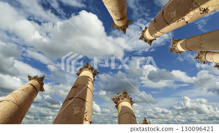 Roman Columns in the Jordanian city of Jerash (Gerasa of Antiquity), capital and largest city of Jerash Governorate, Jordan. Against the background of a beautiful sky with clouds 130096421