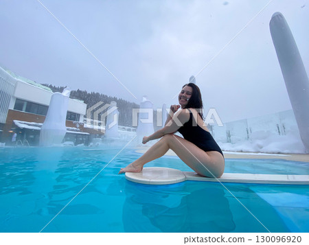 Winter Poolside Relaxation in Snowy Landscape Winter Poolside Relaxation in Snowy Landscape 130096920