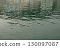 Water textures with light and ripples. Moving water in the harbour give beautiful shimmery textures and surfaces for backgrounds with space for copy 130097087