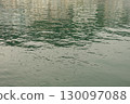 Water textures with light and ripples. Moving water in the harbour give beautiful shimmery textures and surfaces for backgrounds with space for copy 130097088