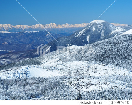 Winter view of Mt. Tateshina and the Northern Alps from Mt. Tengu in the Yatsugatake Mountains 130097648
