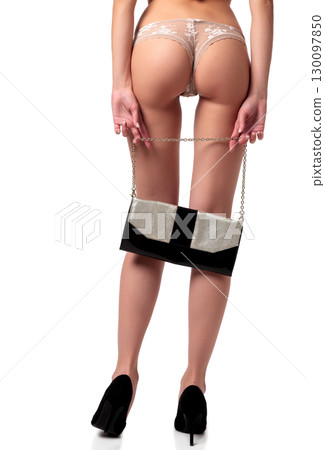 Woman with long legs holds a bag 130097850