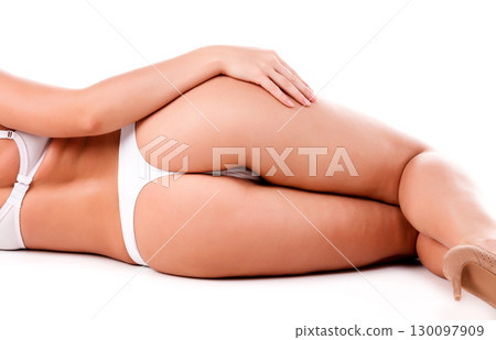 Sexy female ass, isolated on a white background 130097909