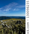 A spectacular view of the Shikoku Karst grasslands and distant mountain ranges 130098235