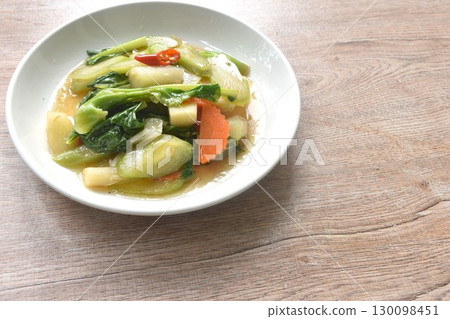 fried Kailaan Chinese kale and carrot dressing oyster sauce on plate 130098451